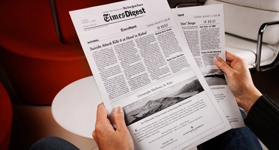 A reader holding the TimesDigest print edition
